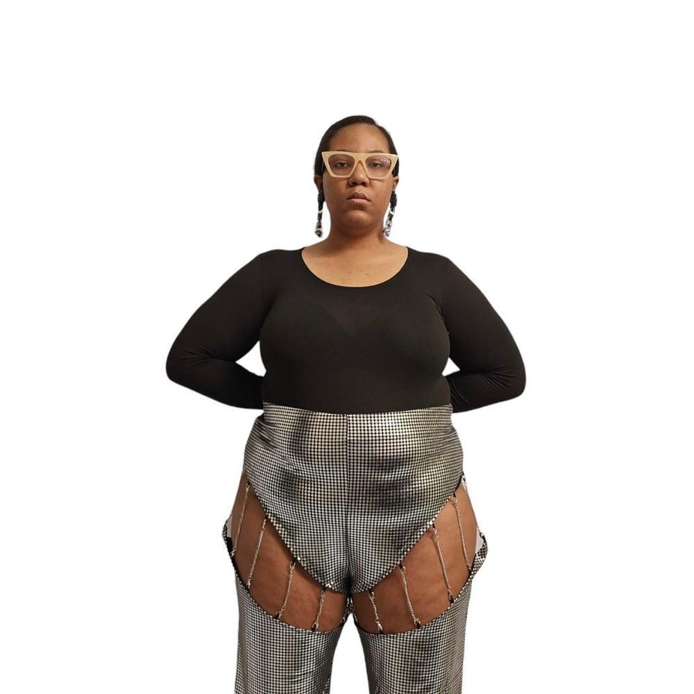 Bold and edgy silver deconstructed flared pants by Finesse